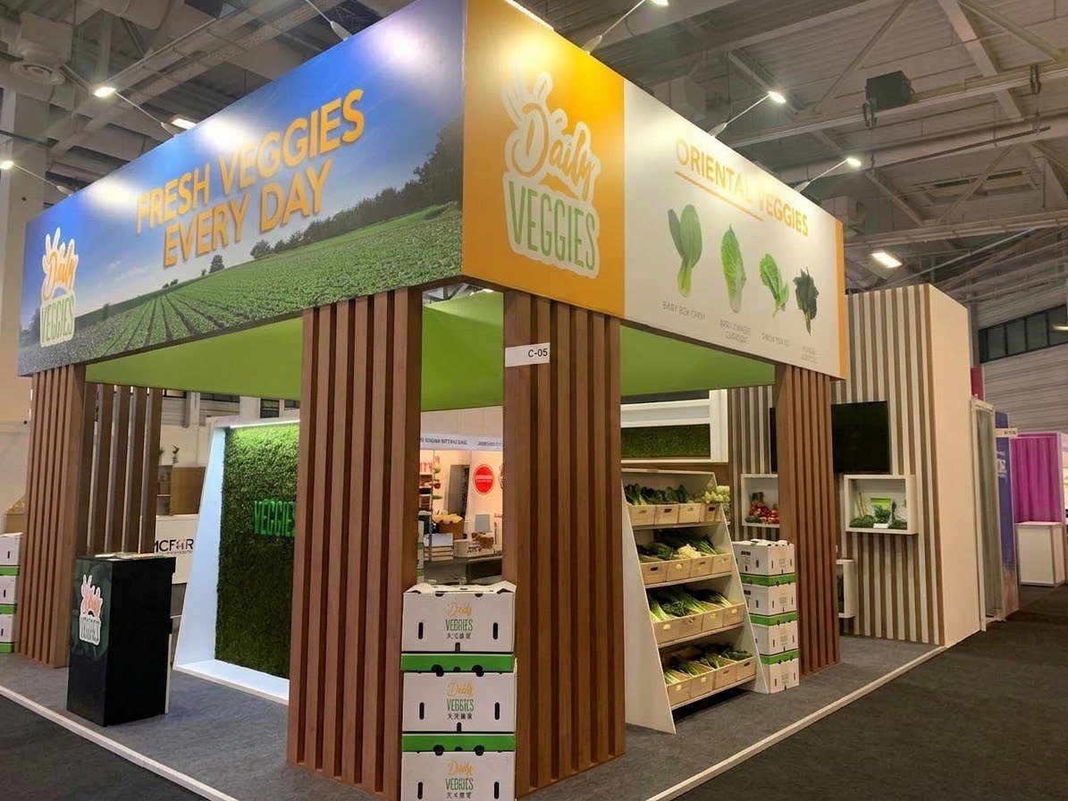 Daily Veggies trade-show stand with Asian vegetables on display